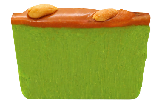 slice of green apple fudge with caramel and nut topping