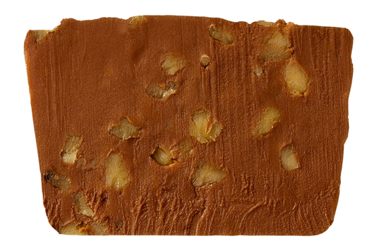 Slice of chocolate fudge with walnut pieces