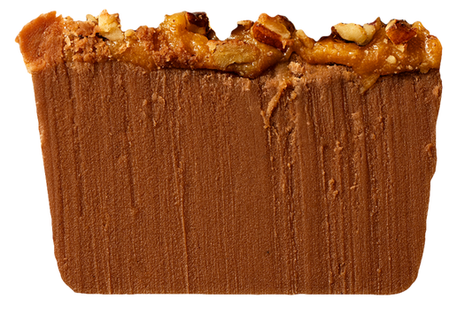 Slice of fudge with pecan and caramel topping