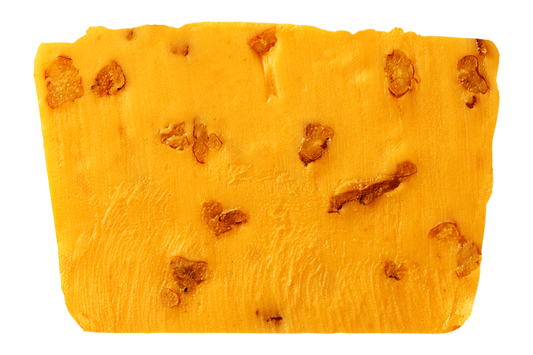 Slice of pumpkin fudge with pecan pieces