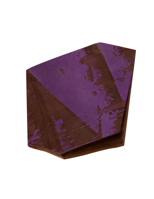 piece of chocolate bark with purple brushed pattern on top