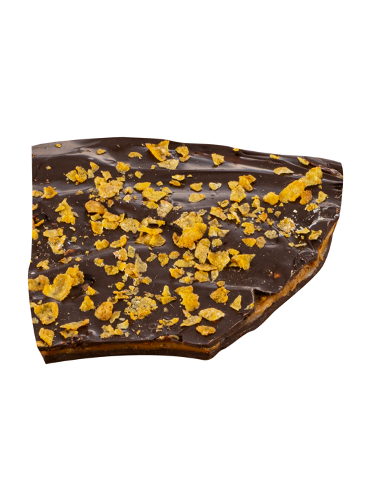 Piece of chocolate bark with caramel filling and yellow crunchy pieces on top