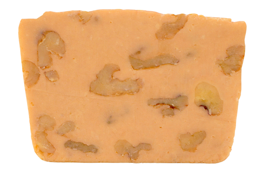 Slice of vanilla fudge with walnut pieces