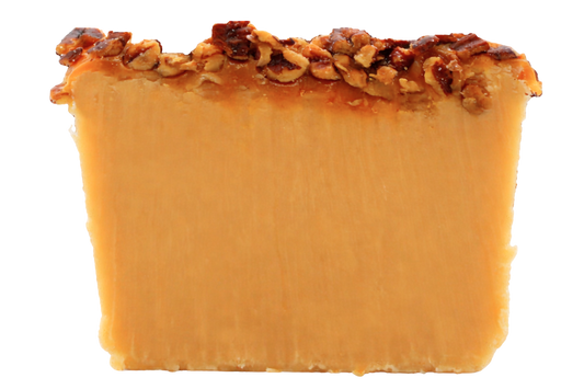 Piece of white chocolate fudge with caramel and nut topping