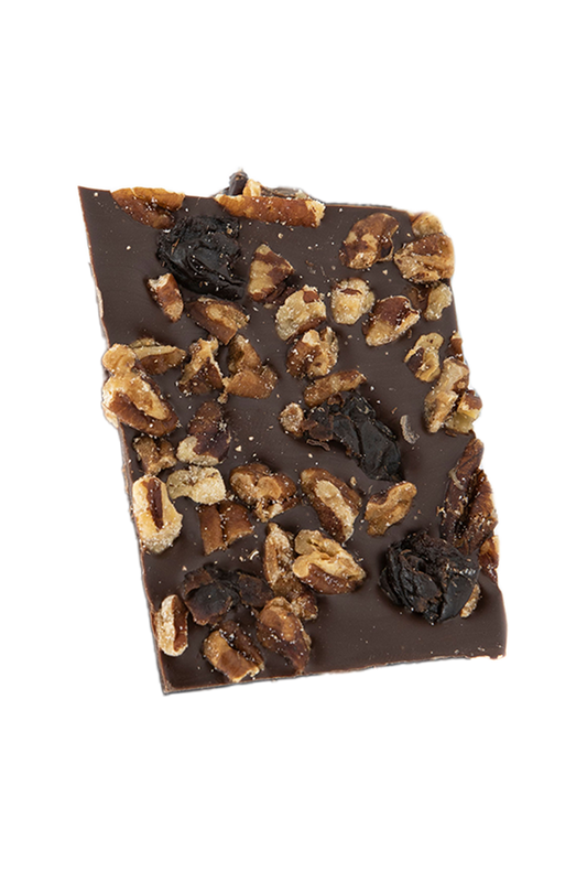 Piece of chocolate bark with pecans and fruit pieces